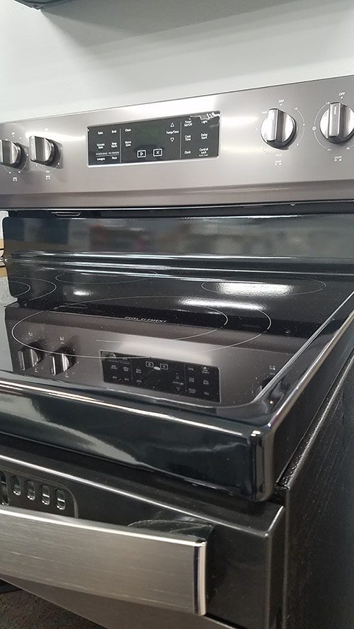 Black oven with an electric stovetop at Don's Plumbing and Appliance Showroom